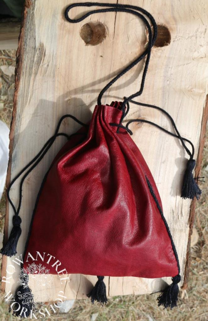 Red leather drawstring purse with black cords