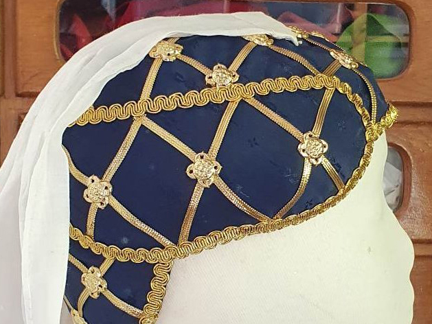 Headdress with gold braid and veil