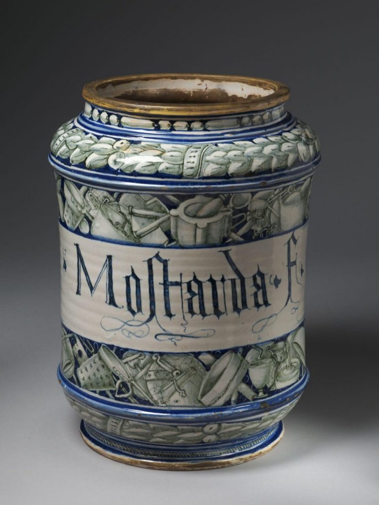 Ceramic jar with the word 'Mostarda' and pictures of cooking implements
