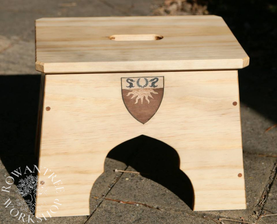 Wooden rectangular stool with heraldic shield in wood inlay