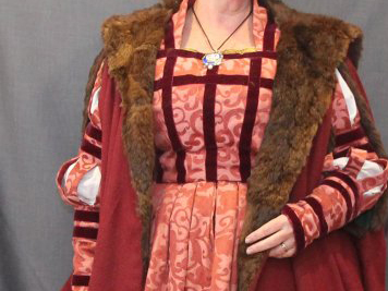 Torso of a woman wearing a German coat with wide fur lapels