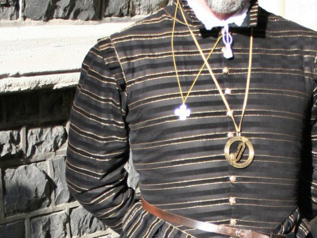 Man's torso wearing Elizabethan doublet with horizontal stripe decoration