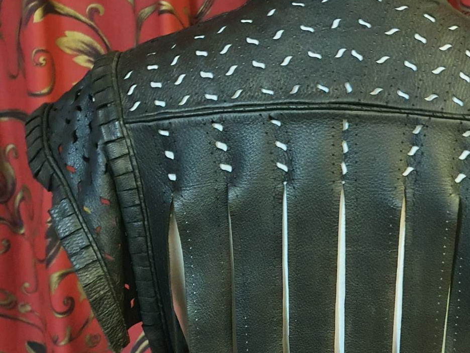 Part of a man's leather jerkin, with elaborate slashes for decoration