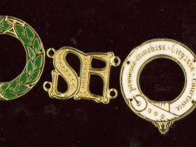 Three medallions in gold with enamel - a laurel wreath, SF symbol and white belt in a ring