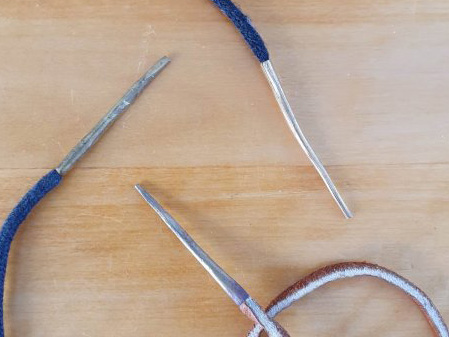 Three laces with metal aglets on the ends