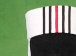 Part of a white hat with vertical stripes